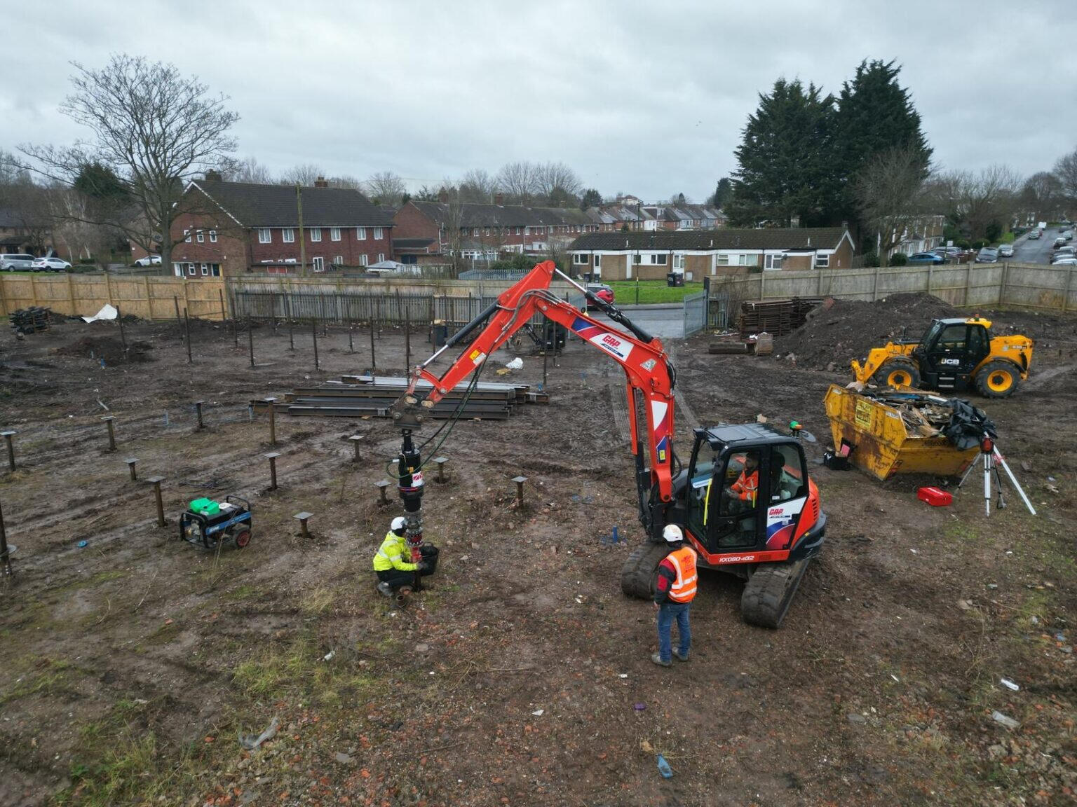 Ground screws being installed for small housing development in Essex.
